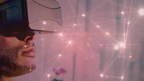 red brillante de conexiones contra el hombre que usa auriculares vr
