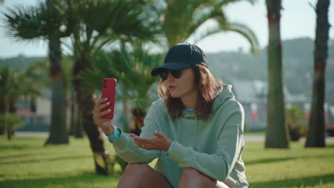 woman having a video call in a park
