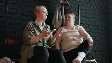 women talking in changing room