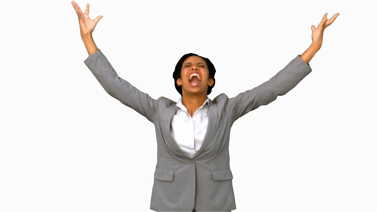Angry businesswoman raising arms on white screen in slow motion