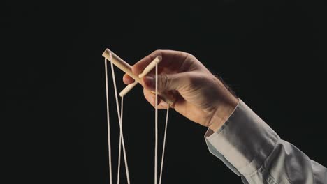Hand Controlling Puppet Strings