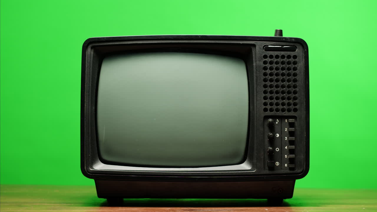 Retro Style TV Set with Green Screen chroma key background, vintage 60s analog television with grain and noise.