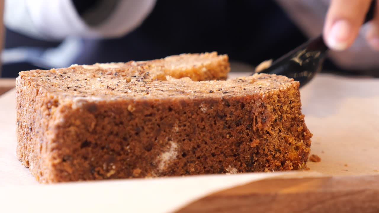 Person eating a slice of bread