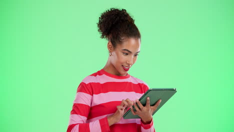 woman using a tablet on green screen