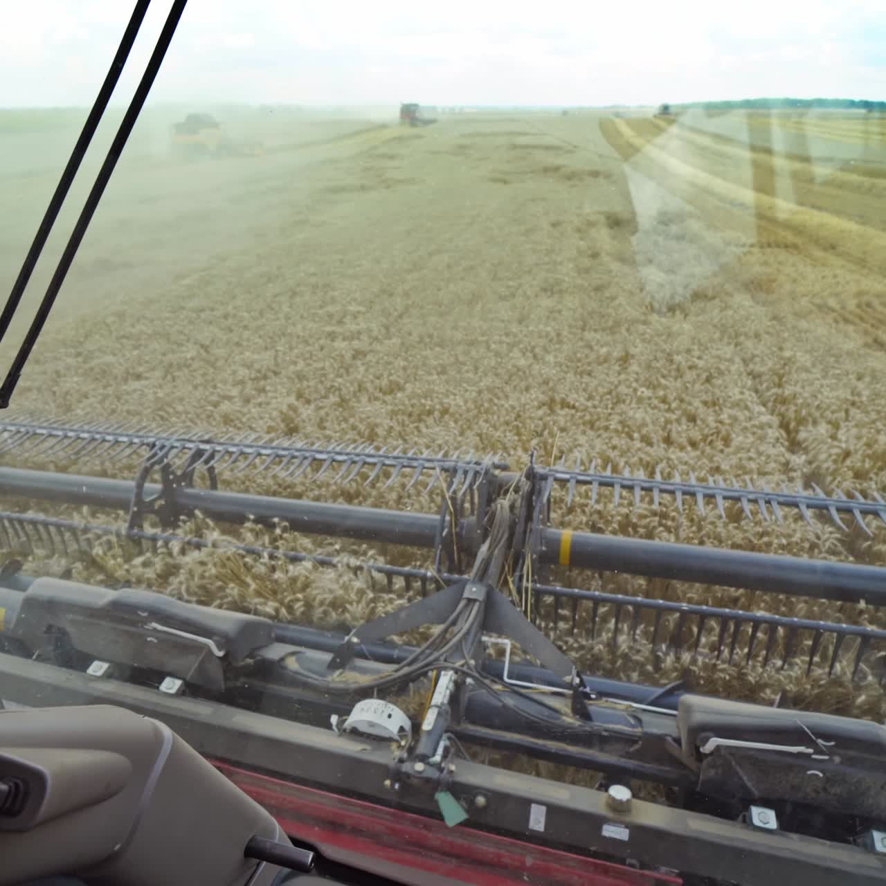 Man working in field in grain combine