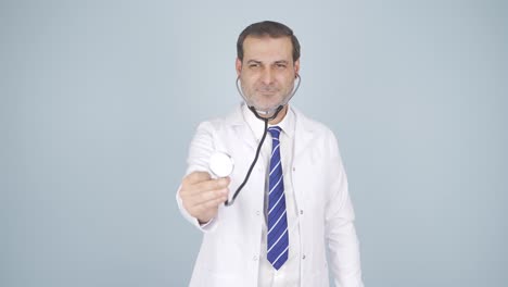 doctor listening to camera with stethoscope.