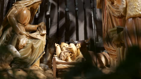 Christmas-Manger-scene-with-figurines-including-Jesus,-Mary,-Joseph,-sheep-and-magi