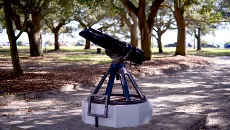 a wide shot of a gatling gun in white point gardens in charleston, sc