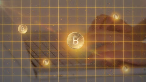 animación de símbolos y líneas de bitcoin sobre manos escribiendo en el teclado