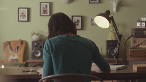 woman sitting at a desk working at home