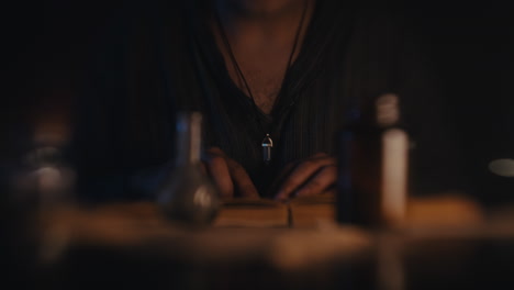 mysterious alchemist studying ancient texts