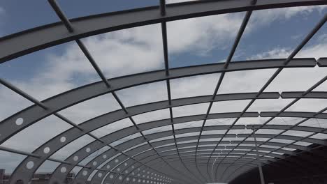 driving under a cool archway over a bridge