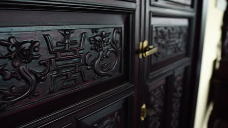 closed doors with chinese engraving inside a house in vietnam