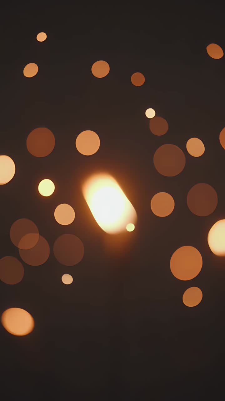 Baggrund med lodret bokeh-lys.