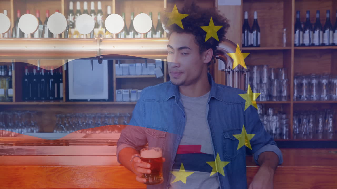 Holding beer at bar, man with European Union flag animation overlay