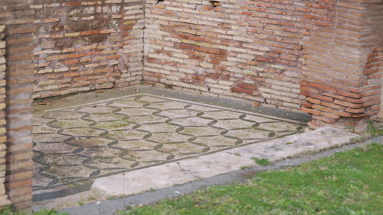 Ancient mosaic tiled floor at the historic archaeological site of Ostia Antica in Rome, Italy.