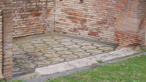 ancient mosaic tiled floor at the historic archaeological site of ostia antica in rome, italy.