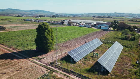 Drone,-engineering-and-people-with-solar-panels