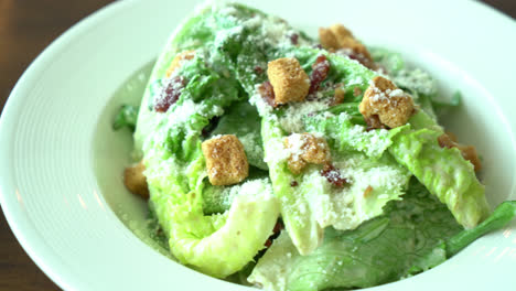 Caesar salad on white plate