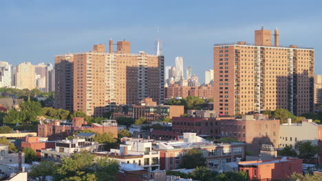 Aerial view of the World Trade Center between two apartment buildings in Brooklyn. Shot on a summer morning in New York City.