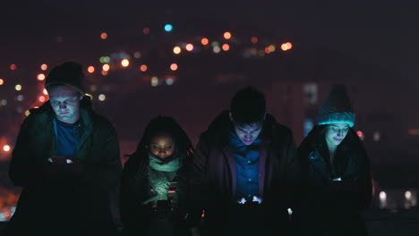 Night,-rooftop-and-gaming-friends-with-smartphone