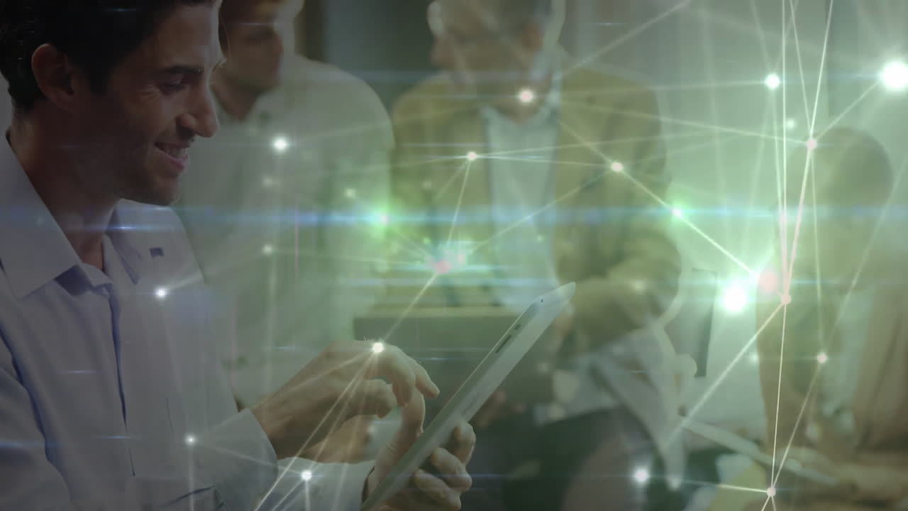 Four professionals tapping tablet in office, sharing business data through digital network overlay