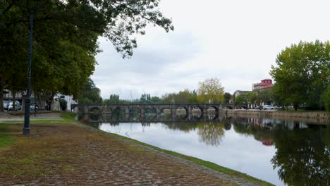 Panoramic-wide-angle-establishing-of-roman-bridge-of-Aquae-Flaviae,-Chaves-Vila-Real-Portugal