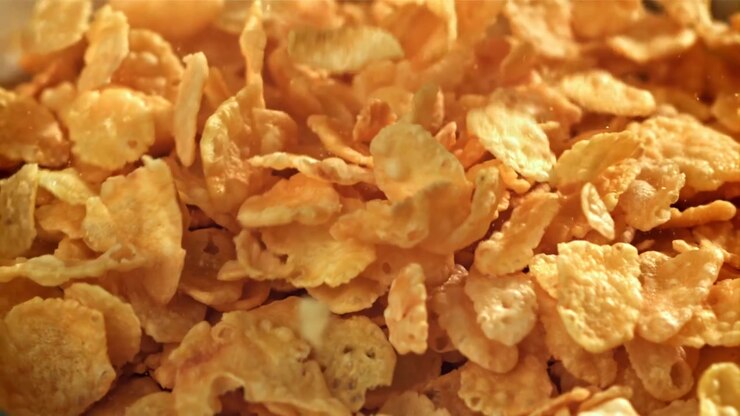 Golden Cornflakes Falling in Slow Motion Close-up