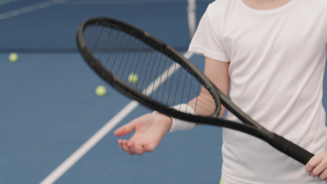 Kid Holding Tennis Racket On Court