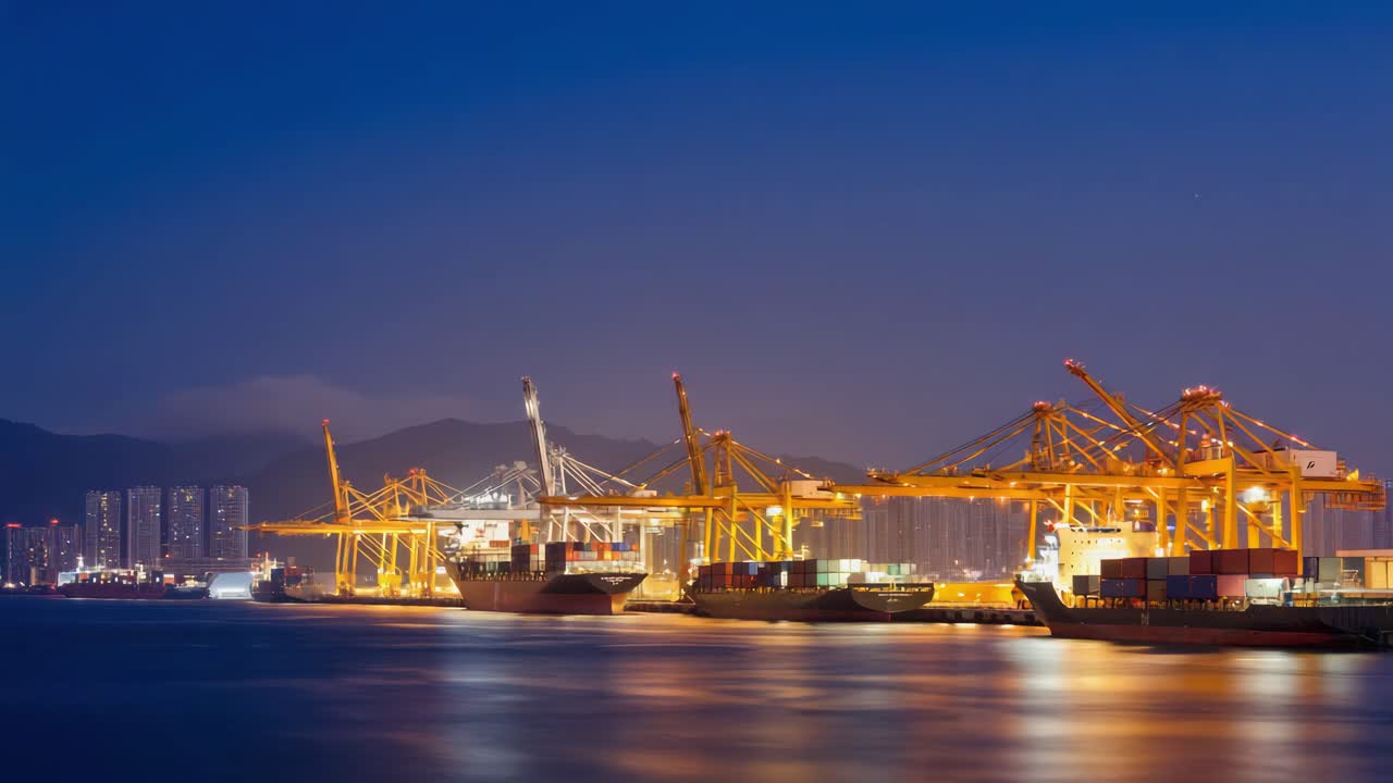 Busy Container Port at Night with Illuminated Cranes and Cargo Ships