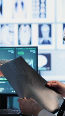 vertical video oncology consultation takes place as a senior medic explains radiology scan