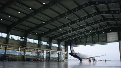 airplane in a hangar during maintenance