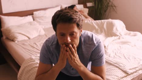 Upset-couple-ignoring-each-other-after-fight-on-bed