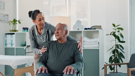 a woman smiles at an older man in a wheelchair, as she puts her arm around him.