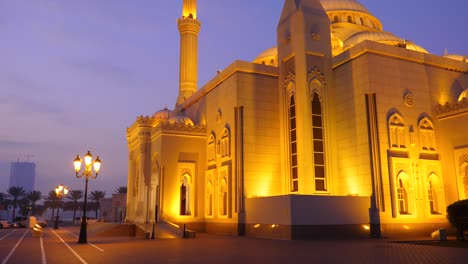 night view to mosque illuminated with golden light. morning or evening dusk. arabian architecture.