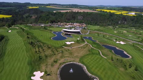 golf course kacov in czech republic, aerial drone view of green course and pond