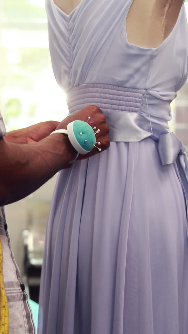 Male fashion designer working with mannequin