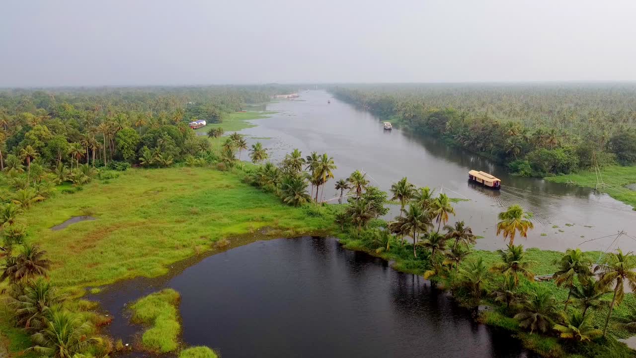 Kerala backwaters aerial, houseboats, lush greenery, palm trees, tranquil river, South India travel and nature