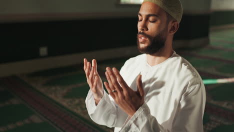 muslim man praying in a mosque