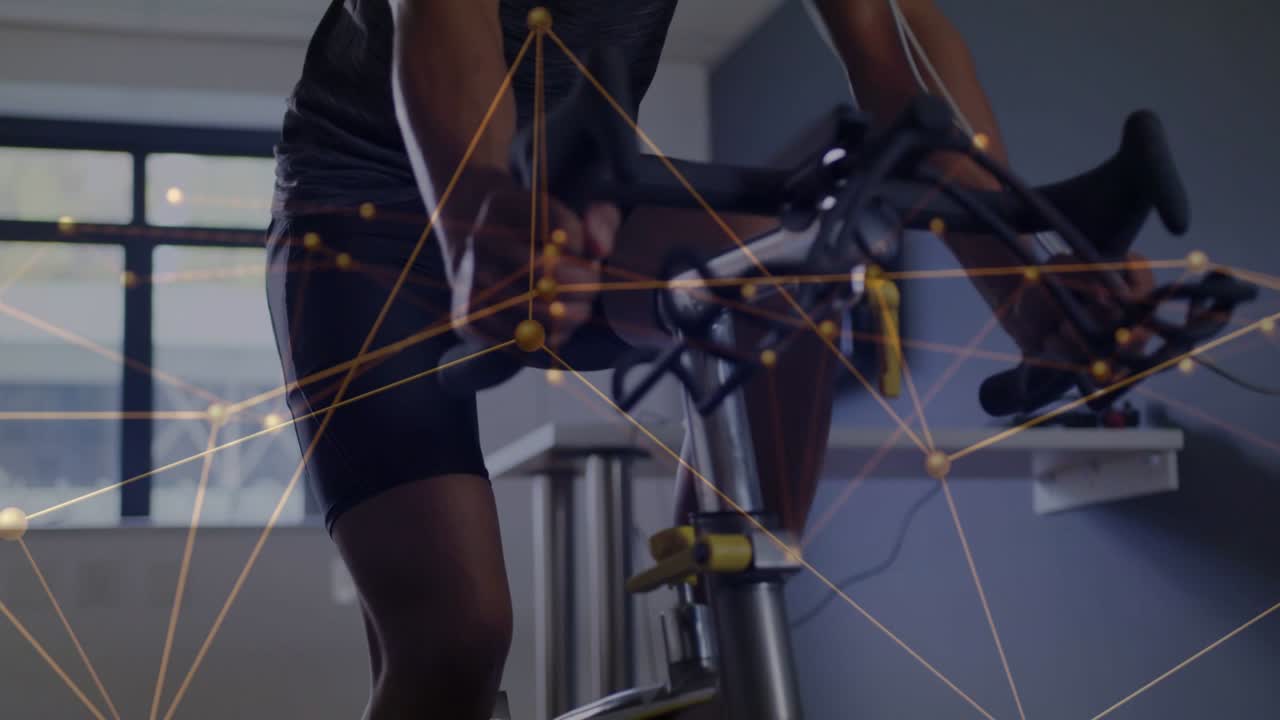 Male doing fitness on bike, camera panning upward, revealing leaning grip and animated data overlay