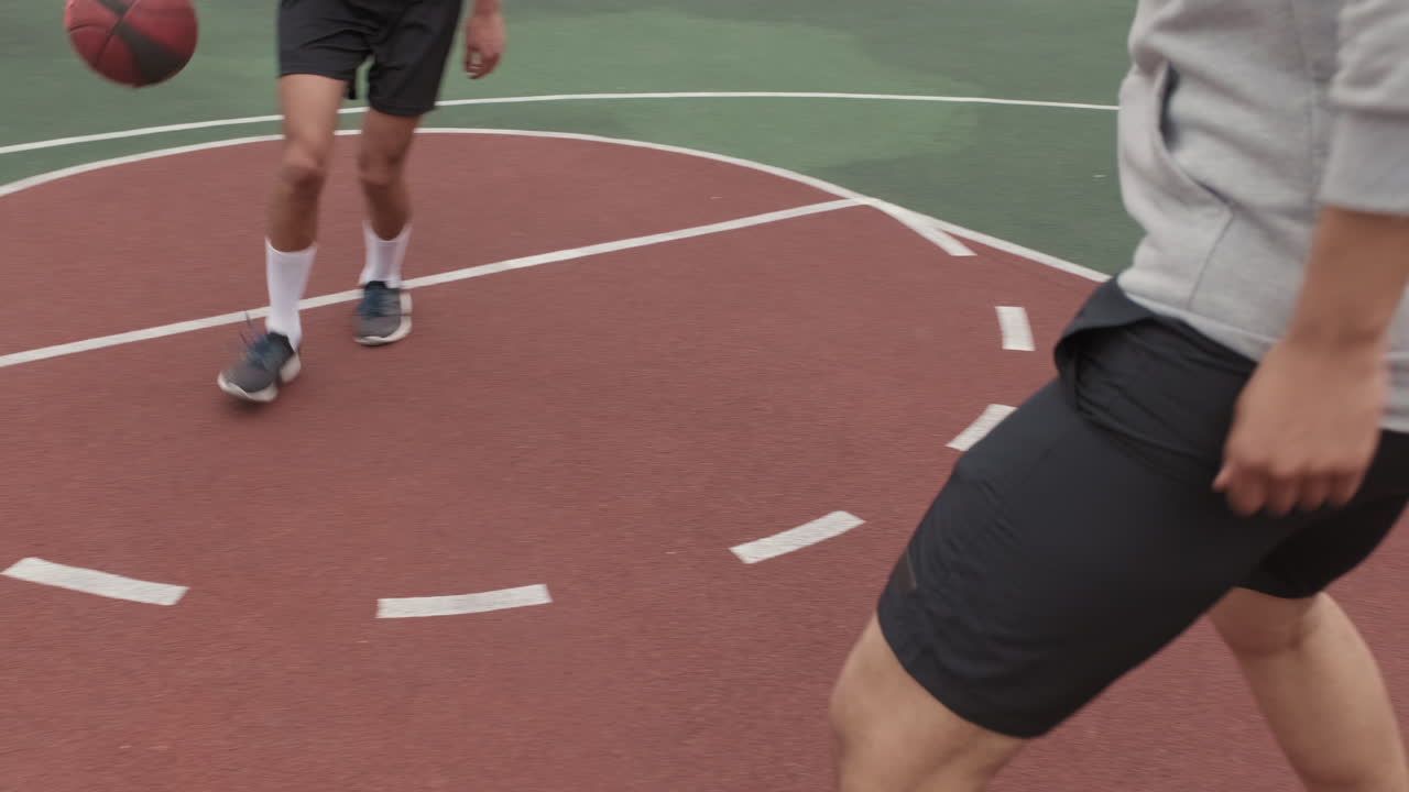 Unrecognizable Men Playing Streetball