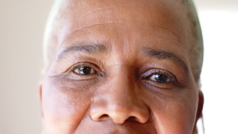 a senior african american woman with brown eyes is looking forward