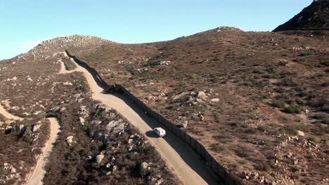 a car drives along a remote road