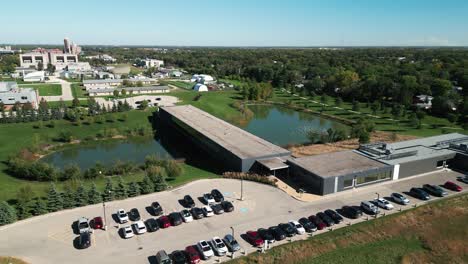drone captures university of manitoba's building from new angle with forest backdrop