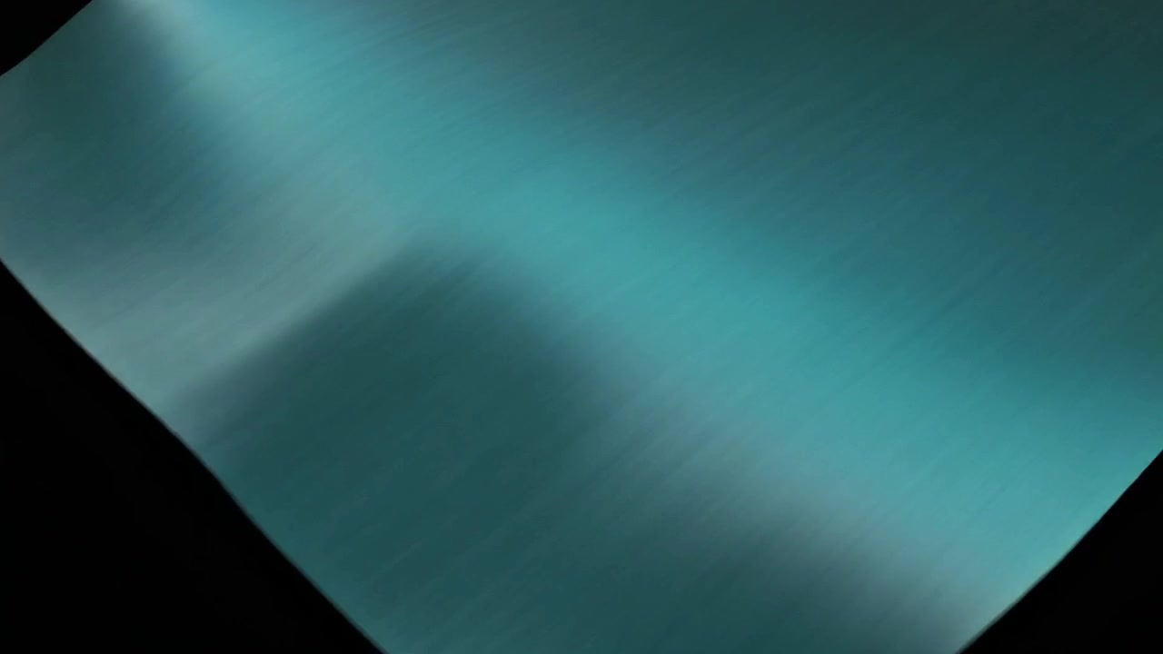 Teal Fabric Unfolding and Revealing Black Background