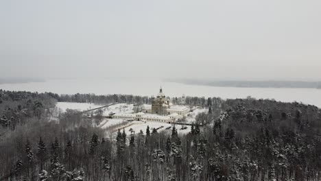 Pazaislis-monastery-in-aerial-drone-distant-winter-shot-during-snowfall