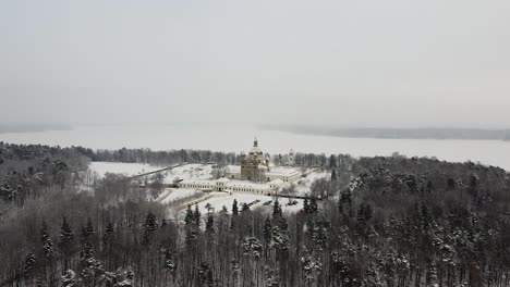 pazaislis monastery in aerial drone distant winter shot during snowfall