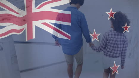 walking hand in hand, people with animation of new zealand flag overlay