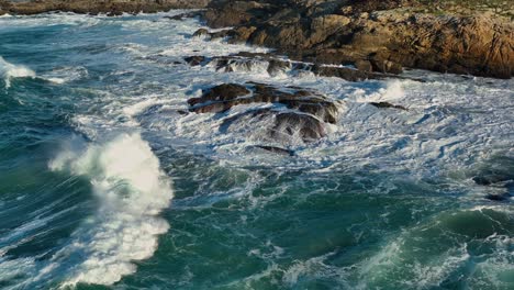 raging swell hitting rocky shore in playa de valcobo, arteixo, la coruña, spain