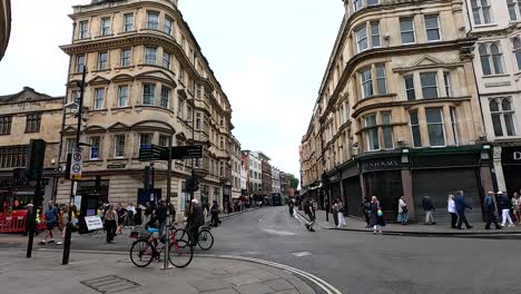 pedestrians and cyclists on a bustling street